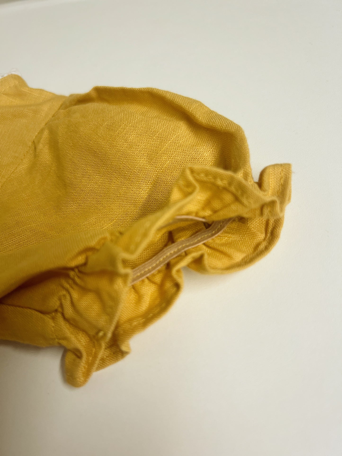 Golden Daisy | hand-embroidered linen blend romper | size 56 (0-3 months)