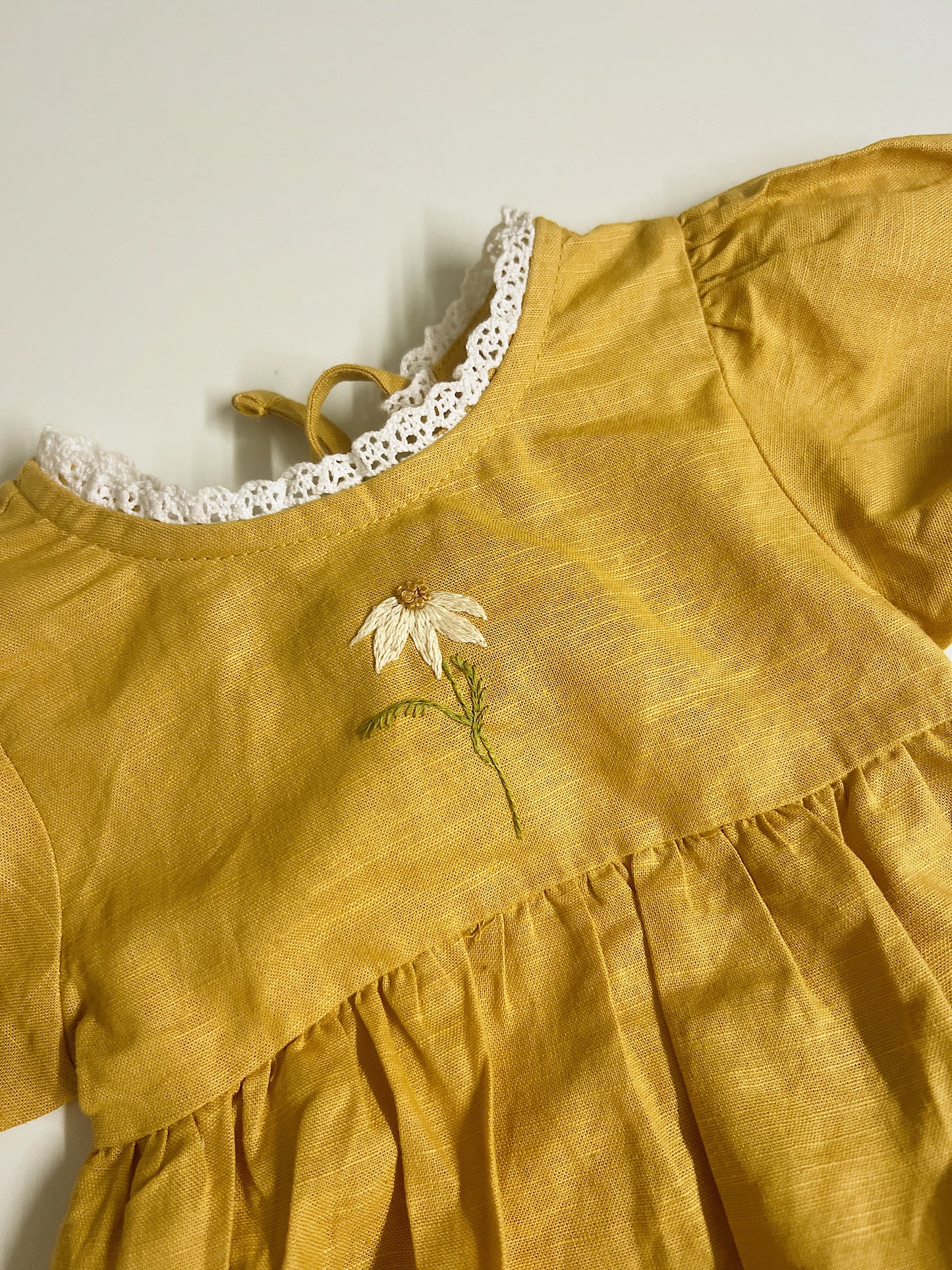 Golden Daisy | hand-embroidered linen blend romper | size 56 (0-3 months)