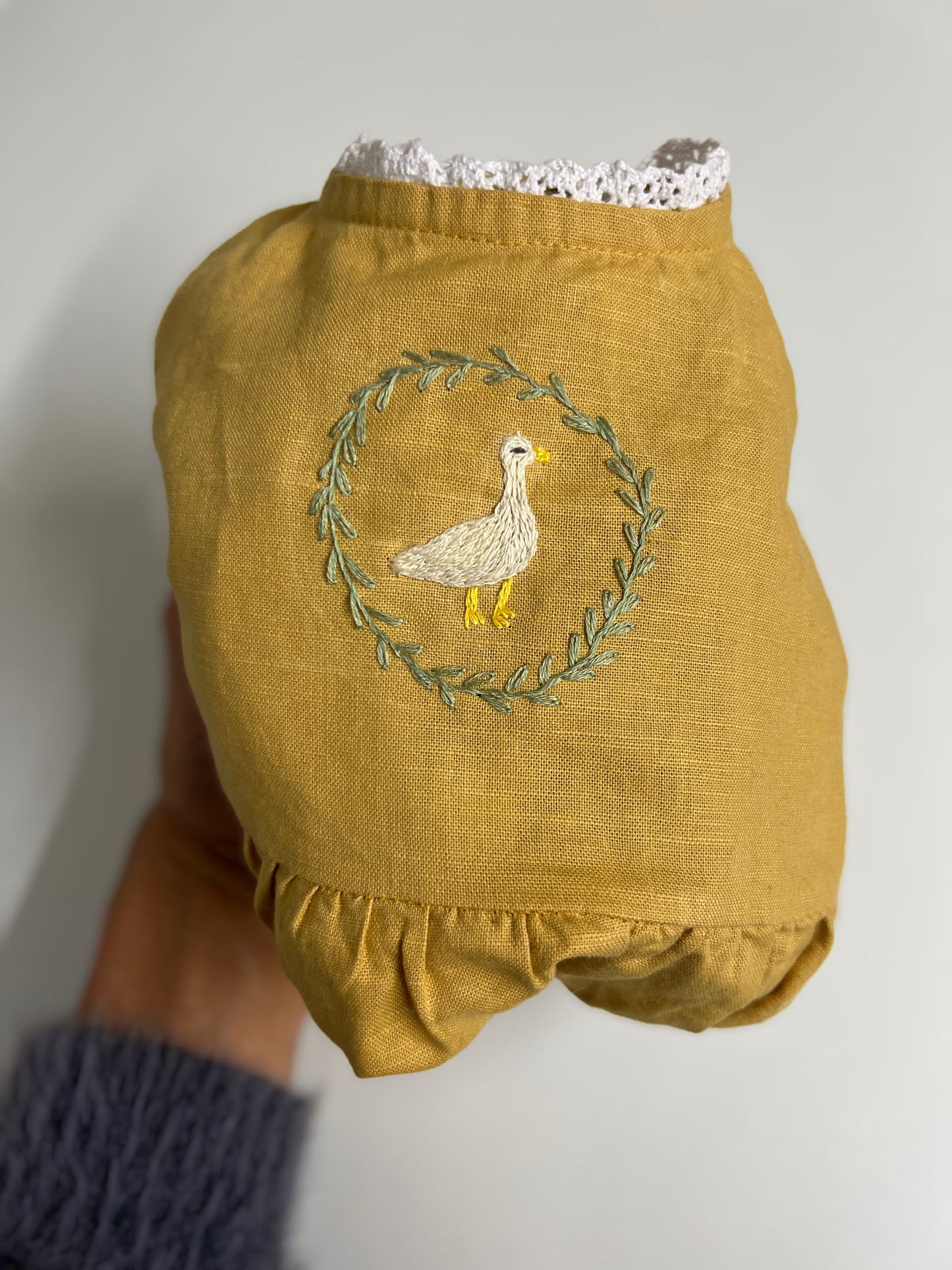 Goose in the Garden | Hand-Embroidered Linen Romper | 6–12 months