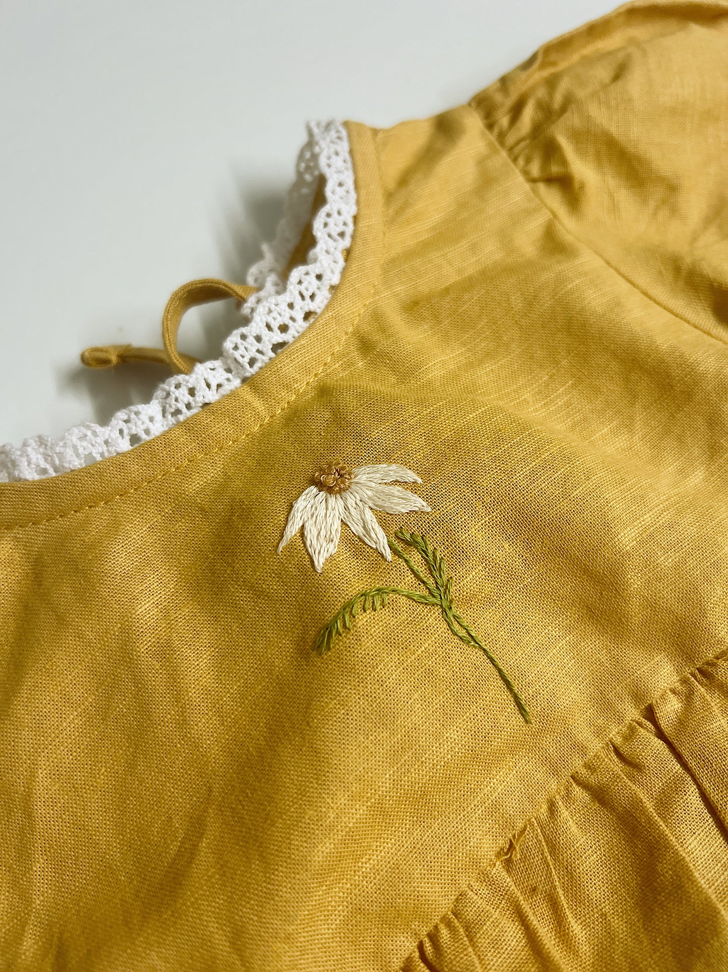 Golden Daisy | hand-embroidered linen blend romper | size 56 (0-3 months)