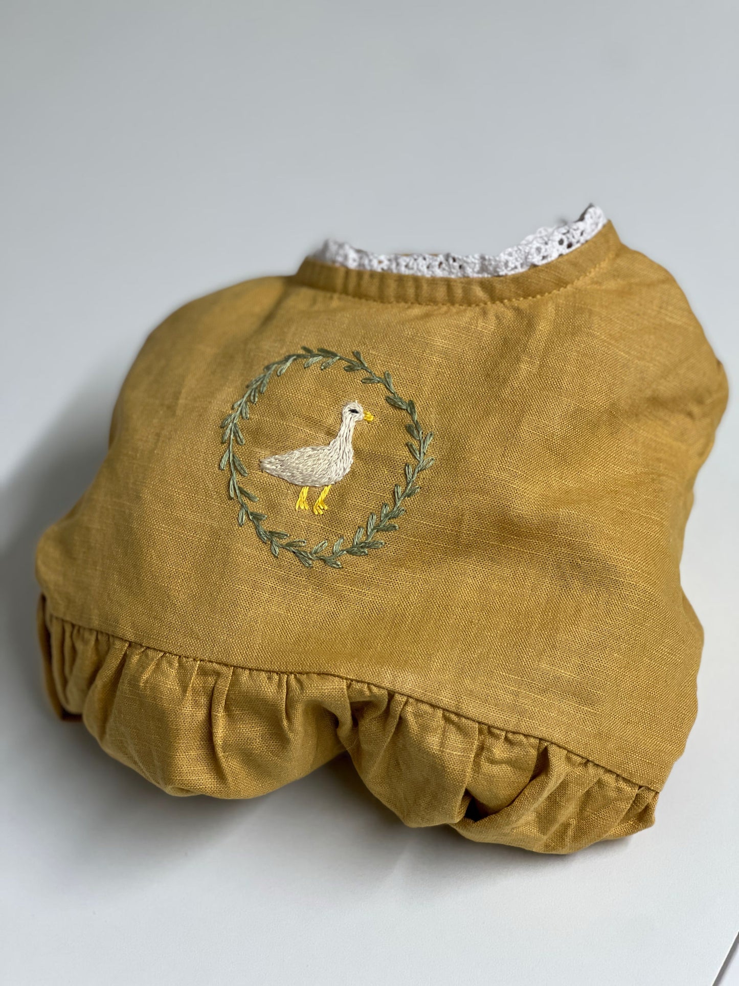 Goose in the Garden | Hand-Embroidered Linen Romper | 6–12 months
