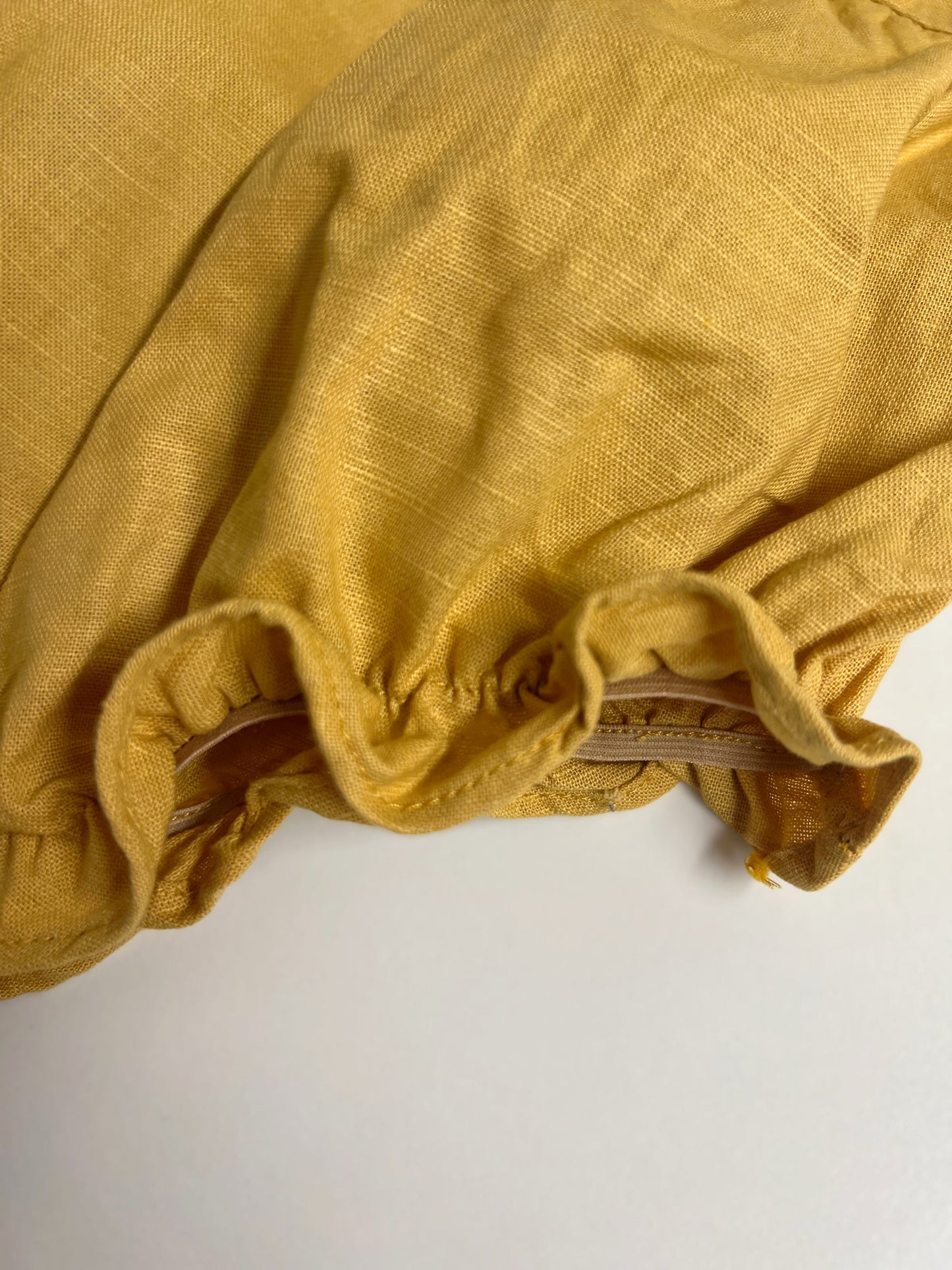 Goose in the Garden | Hand-Embroidered Linen Romper | 6–12 months